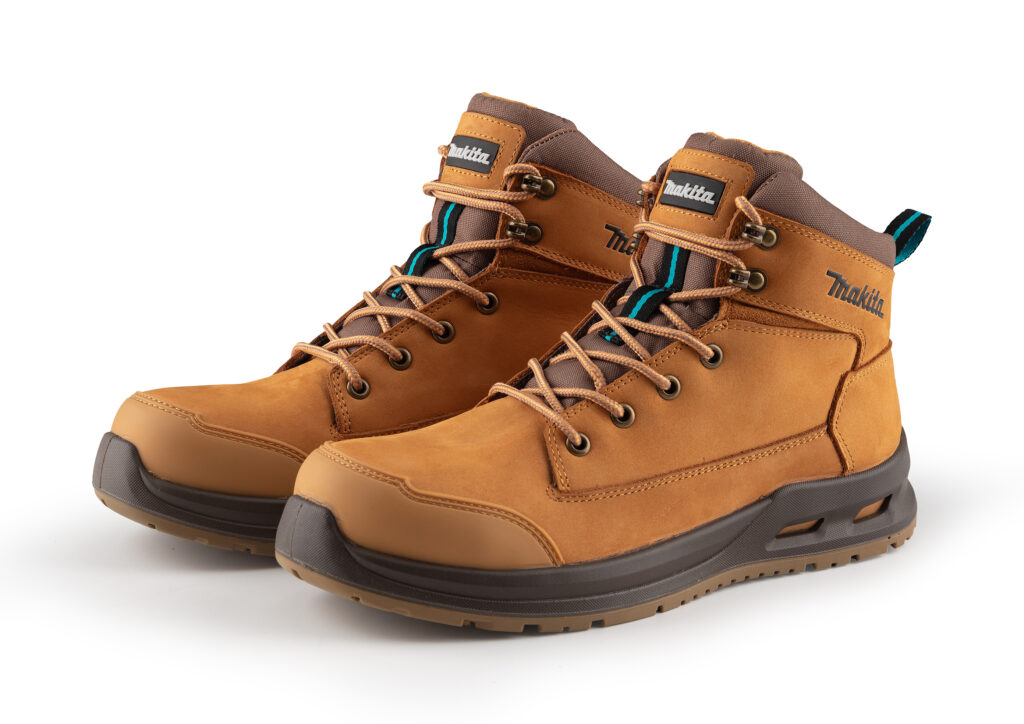Pair of brown hiking boots with tan leather panels, tan laces, and rugged grey outsole; Makita branding visible on the side.