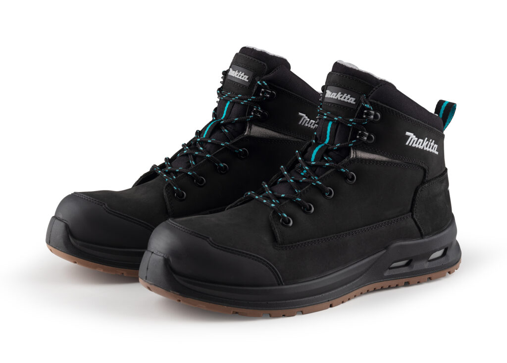 Black Makita hiking boots with teal laces and rugged rubber soles, shown from a side angle.
